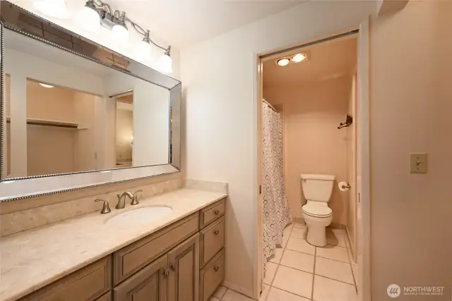 Master bath, dressing area with additional closet on the right.