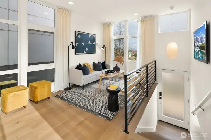 Tall ceilings and over-sized windows flood the living spaces with warm, natural light throughout the day.