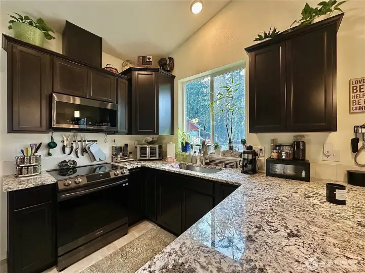 Kitchen with granite counters.