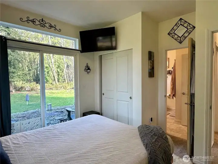 Primary with access to backyard.