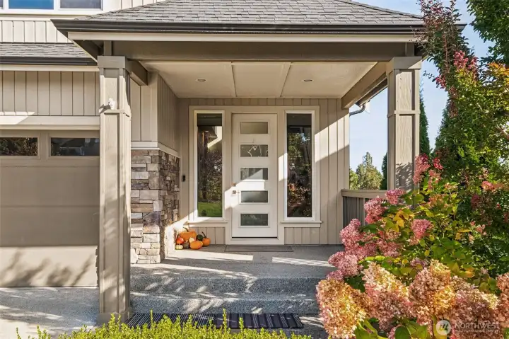 Inviting covered front porch with stone accents and a welcoming entry!