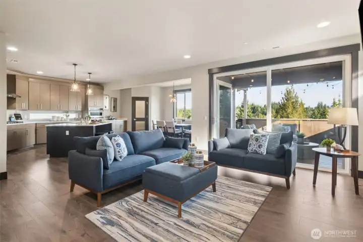 Double glass sliders take you out to the entertainment-size covered deck, complete with BBQ gas plugin and mounted TV!