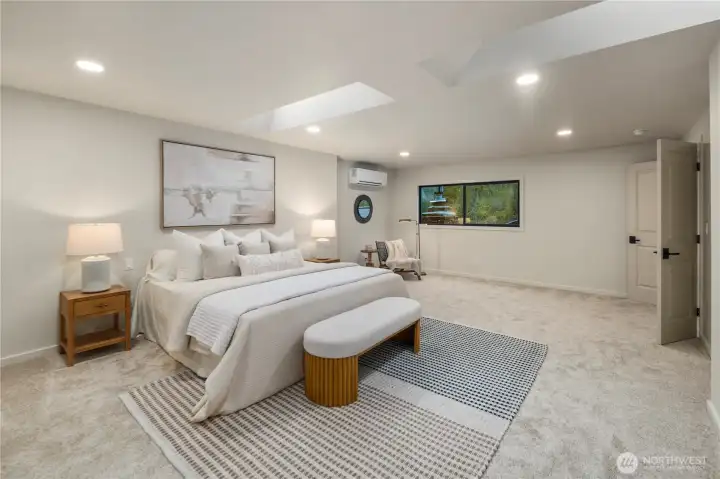 Large Primary suite features lake views from the window. So much natural light and large walk in closet.