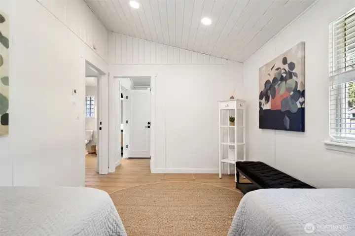 Guest bedroom can connect to the primary suite, laundry room and bathroom.