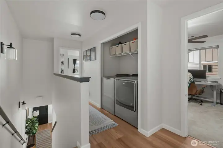 Upstairs hallway with laundry closet.