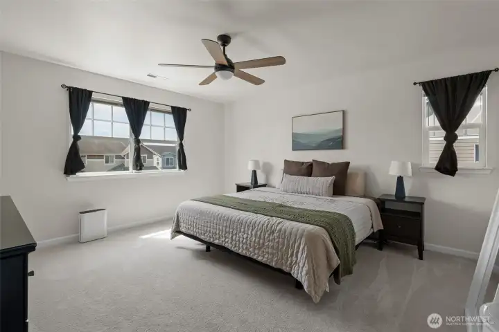 Two windows bring in the light to this beautiful primary.