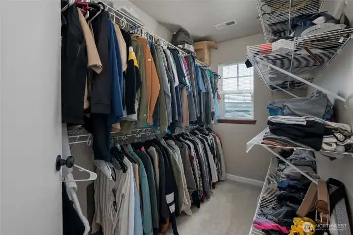 Primary bedroom walk in closet.