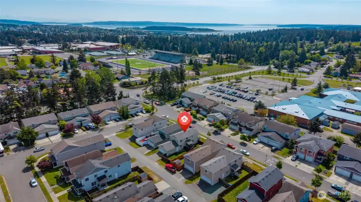 Aerial view showing proximity to Hillcrest Elementary School and Oak Harbor High School.