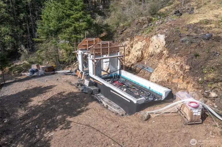 The greenhouse building site is easily accessible and ready for completion.