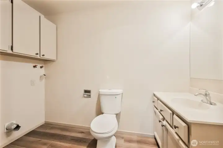Main level half bath with washer and dryer hookups