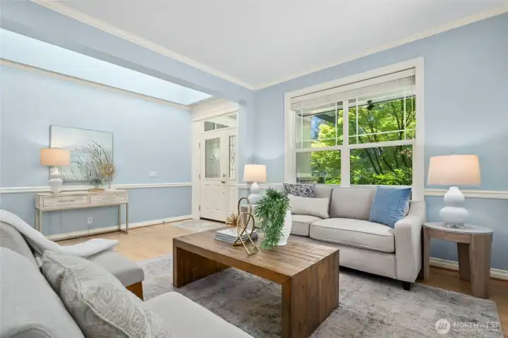 Formal living room with beautiful front yard views and lots of fine finish work.