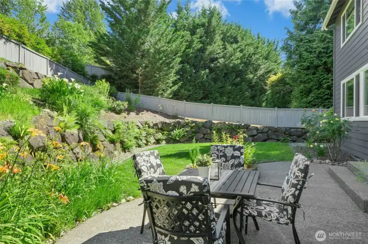 Professionally landscaped property features a fully fenced backyard and sprinkler system.
