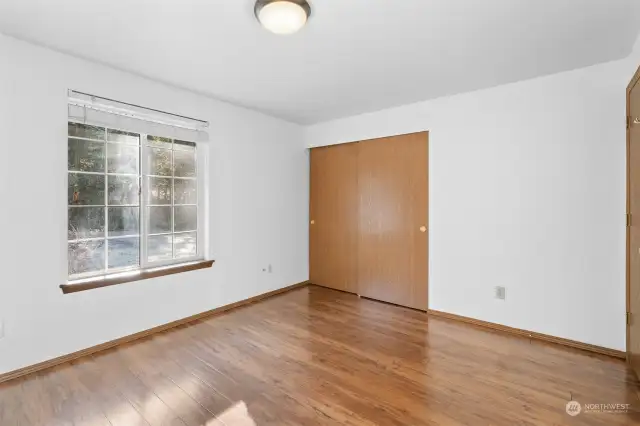 Another view of the second guest bedroom showing the double door closet.