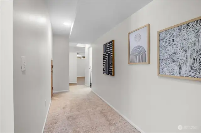 Lower hallway leading to the laundry room and bathroom.