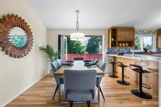 Easily host a crowd in the open dining area with space for additional seating at the breakfast bar.