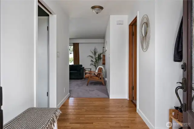 to the left is  the formal dining room with fireplace, straight forward to the livingroom or head right down the hall to the bedrooms