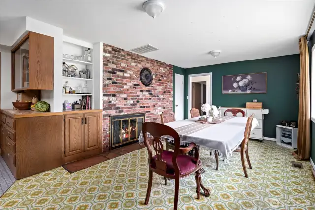Formal dining with fireplace off of the kitchen