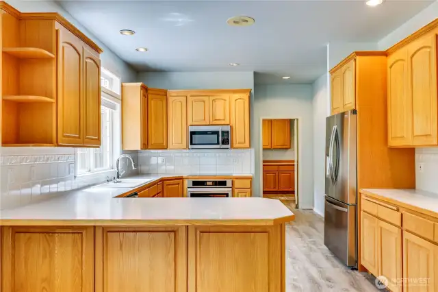 The spacious kitchen has extensive work space and cabinetry.