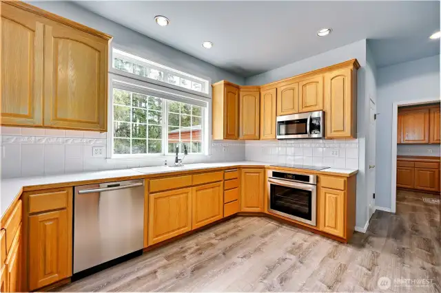 All new appliances. The door behind the oven is a large walk-in pantry.