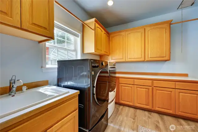 The large laundry/mud room sits between the kitchen and the garage.