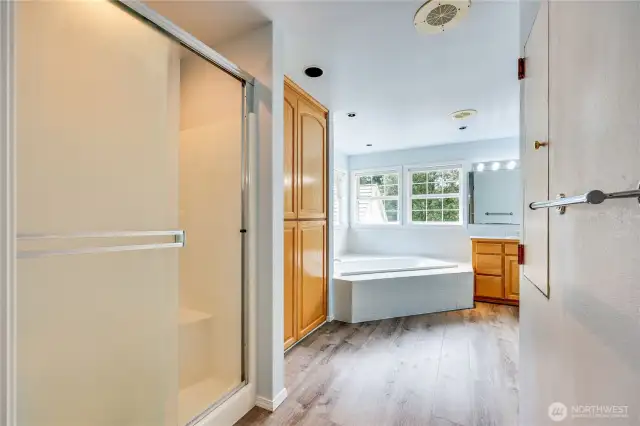 Shower and large linen/storage closet.  Even a laundry chute.