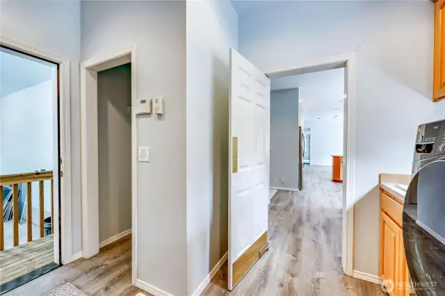 Leaving the interior of the home via the laundry/mud room into the attached garage.