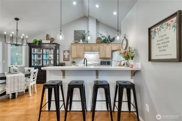 Nice eating bar with shiplap and new pendant lighting.