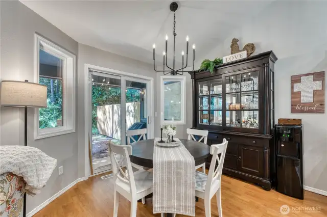 Eating nook off kitchen leading to covered back patio.