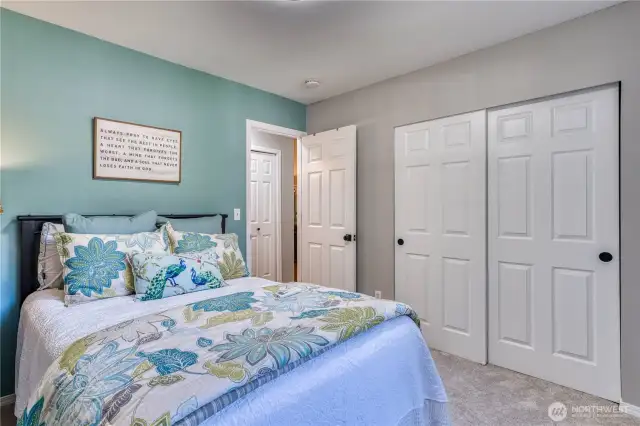 Another view of 2nd bedroom with great closet space and accent wall.