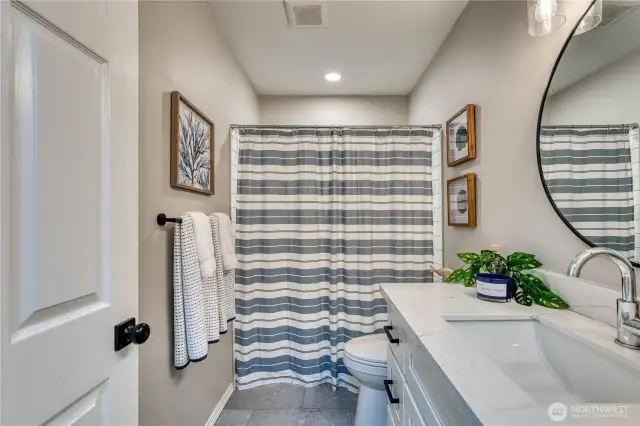 2nd bathroom with new vanity, quartz tops, new tub and tiled shower, flooring and more...