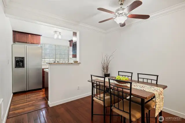 Ceiling fan in the dining room.  Plenty of space to gather here.