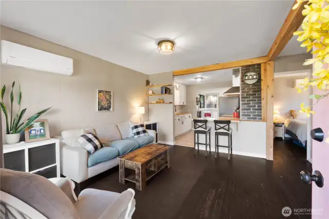 Original wood floors and exposed brick keeping the charm of age of the home.