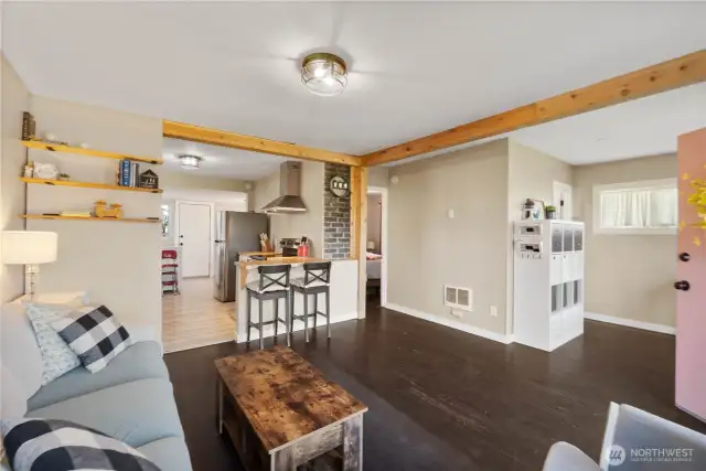 Breakfast bar and exposed beams.  New paint throughout as well as new trim and solid wood doors.