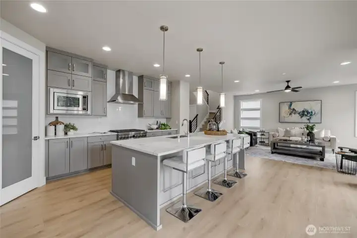 Dining area filled with natural light – drapery included.