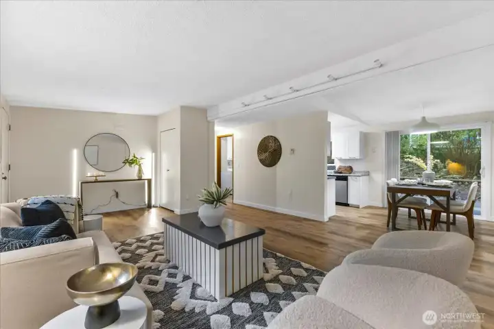The living room leads to the dining room and kitchen.