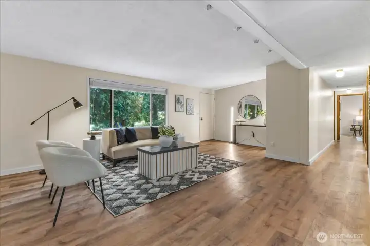 The living room leads to the dining room and kitchen.