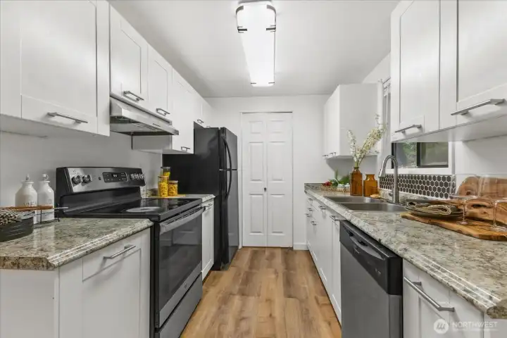 Kitchen with updated appliances and cabinets.
