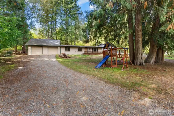 Long driveway with plenty of room for all of your toys and even an RV.