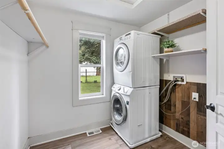 Primary closet comes with its own washer and dryer.