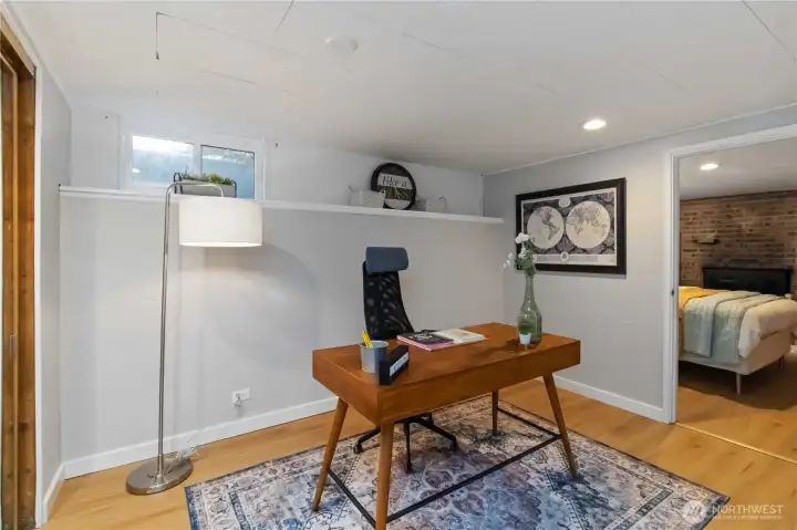 Versatile lower-level flex space, perfect for a  home office, study, or creative retreat.