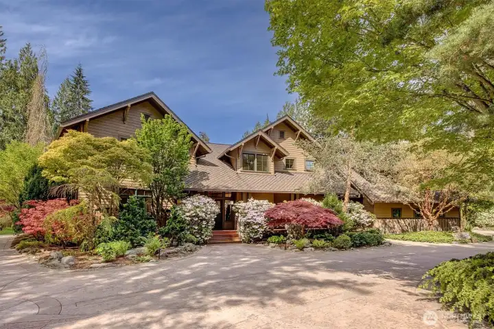 Stunning Craftsman home in Arlington, perfectly sited on 10.3 acre lot with park-like grounds and 606 feet of river frontage  along Pilchuck Creek