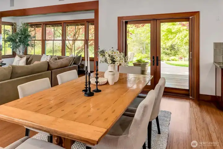French doors from the dining room to the deck, patio and river