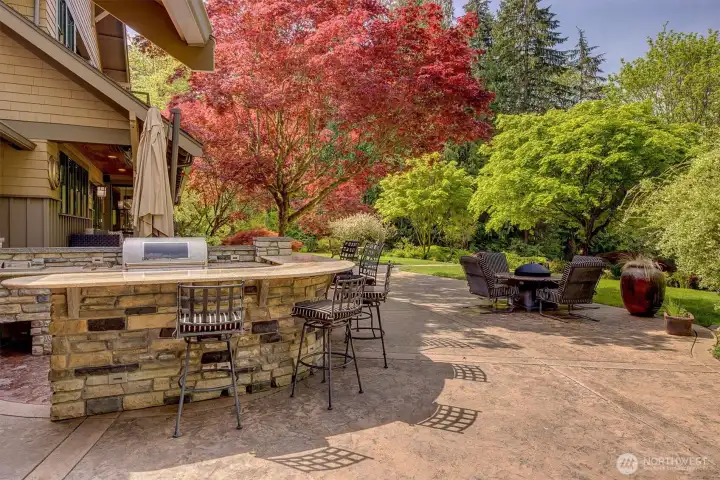 Exterior kitchen with BBQ off the back of the home allows for gatherings and entertaining.