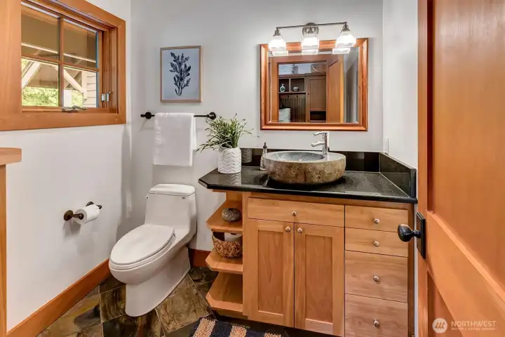 Main level powder room off the kitchen