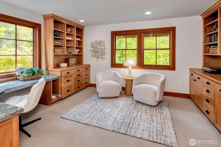 Upstairs office with built-in storage and bookshelves