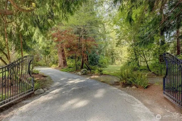Escape to Arlington, one hour north of Seattle, and a world away! An inviting gated entry leads into your stunning property.