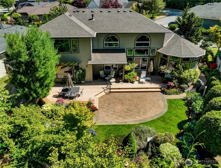 The sunny deck, with built-in benches, is a great place to entertain friends or relax on a summer afternoon. The deck steps down to the paver patio that leads to the paver path on the side of the home. The sunny deck, with built-in benches, is a great place to entertain friends or relax on a summer afternoon. The deck steps down to the paver patio that leads to the paver path on the side of the home.