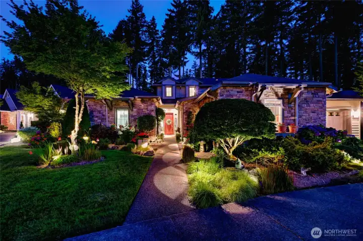 Stunning outdoor lighting highlights the gorgeous plantings in the yard. Stunning outdoor lighting highlights the gorgeous plantings in the yard.