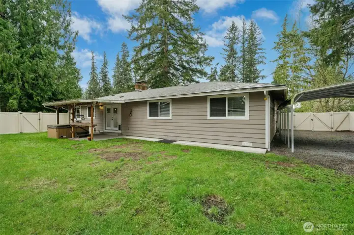 Very generous lot with ample space for gardening, play and even RV/boat/trailer carport parking.