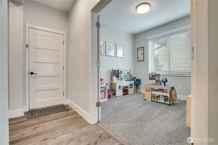 Versatile main floor space—ideal for a home office, playroom, or flex area